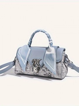 ライトブルー本物合成皮革ボストン枕バッグ - シックな女性用クロスボディ＆ショルダーハンドバッグ、エンボス加工の花柄デザイン、編み込みハンドル、装飾的なリボンアクセント付き、ショルダーバッグ | シックな女性用バッグ | メタリック装飾